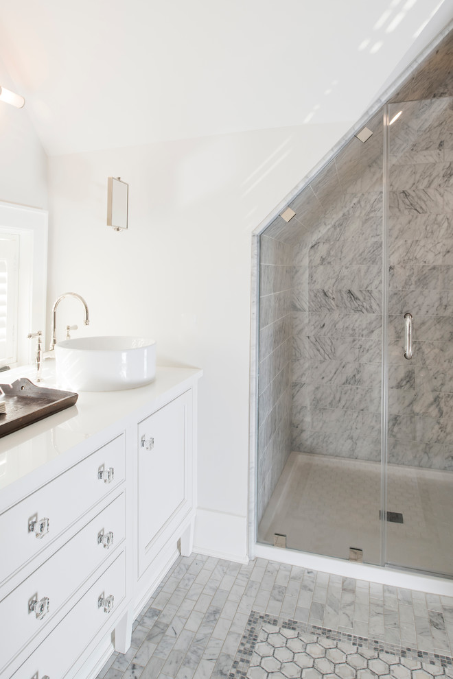 Design ideas for a small contemporary master bathroom in New York with beaded inset cabinets, white cabinets, an alcove shower, stone tile, white walls, marble floors, a vessel sink, solid surface benchtops, grey floor and white benchtops.