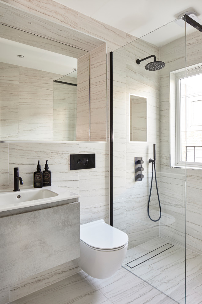 Small contemporary master bathroom in London with beige cabinets, an open shower, a wall-mount toilet, beige tile, marble, marble floors, a drop-in sink, marble benchtops, an open shower, beige benchtops, a single vanity and a floating vanity.