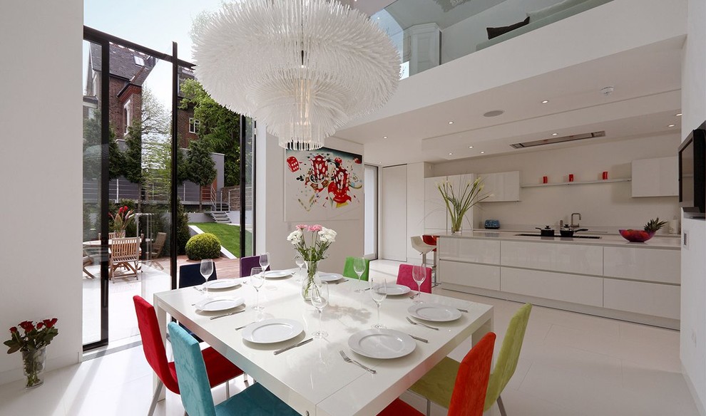 Inspiration for a large contemporary open plan dining in London with white walls, porcelain floors and white floor.