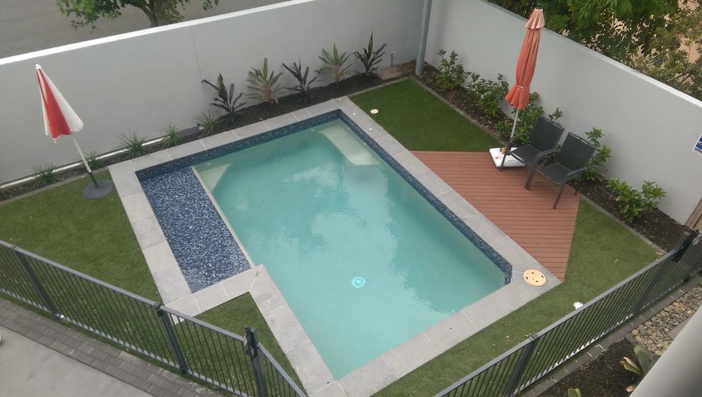 Inspiration for a small contemporary backyard rectangular pool in Brisbane with decking.