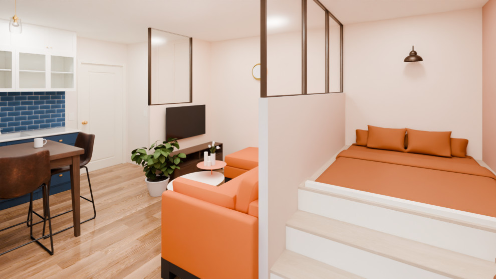 Espace de vie compact : cuisine, repas et salon réunis dans un studio
