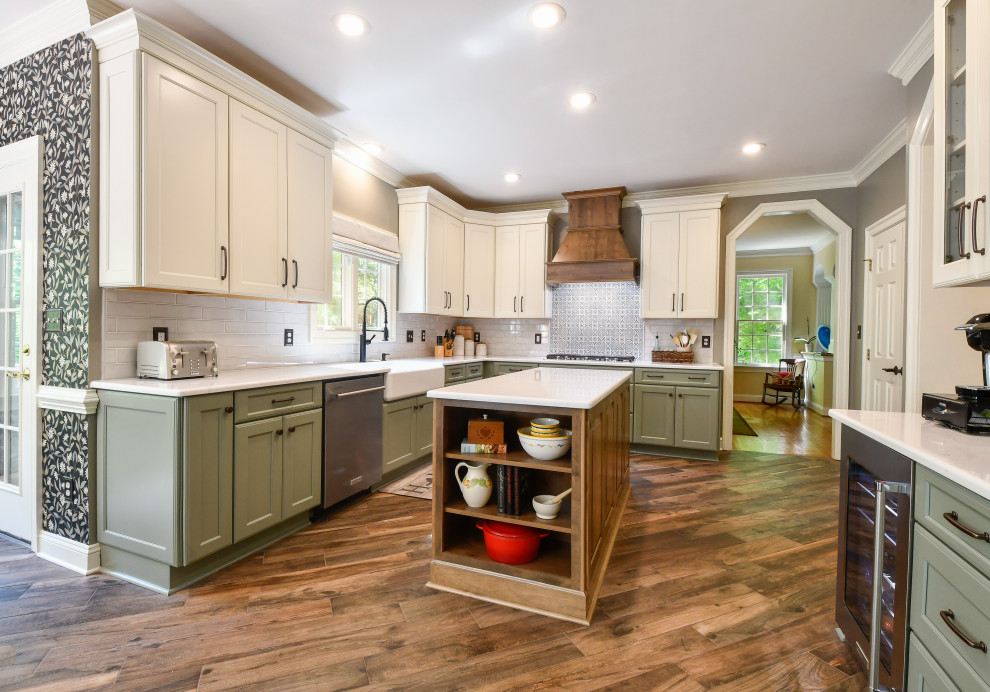 Example of a huge transitional u-shaped kitchen pantry design in DC Metro with a farmhouse sink, recessed-panel cabinets, quartz countertops, subway tile backsplash, stainless steel appliances, an island and white countertops