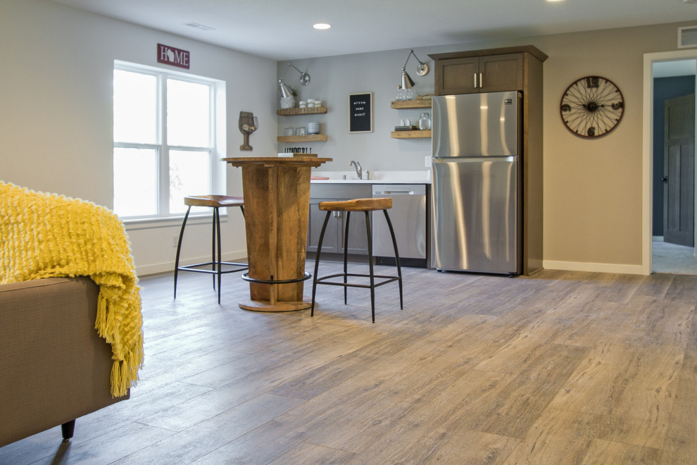 Inspiration for a transitional walk-out brown floor and vinyl floor basement remodel