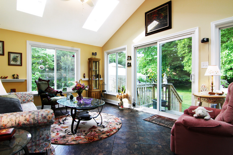 Mid-sized traditional sunroom in Philadelphia with slate floors, no fireplace, a skylight and black floor.