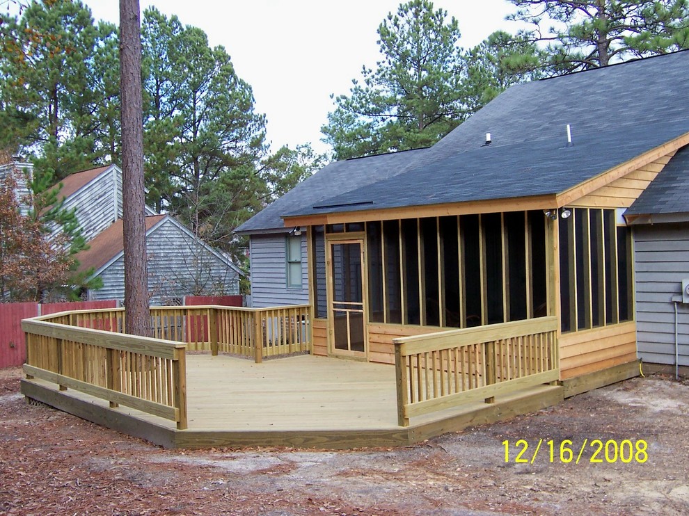 Example of a mid-sized mountain style backyard deck design