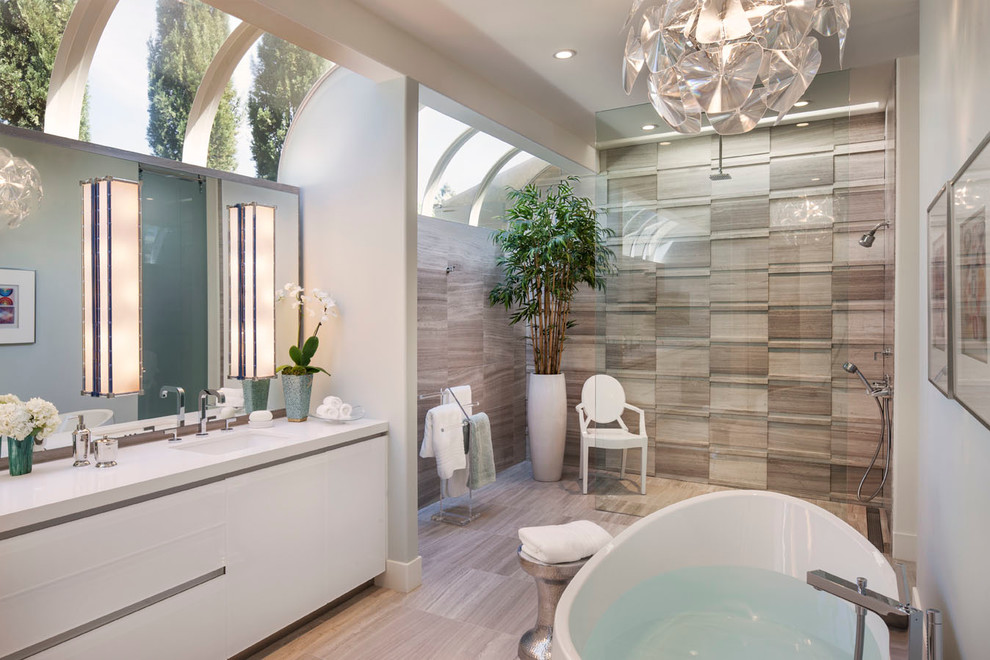 Design ideas for a contemporary master bathroom in Los Angeles with an undermount sink, flat-panel cabinets, white cabinets, a curbless shower, beige tile and grey walls.