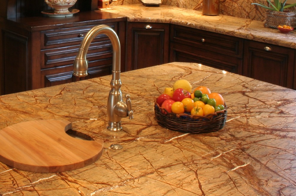 Open concept kitchen - large transitional u-shaped terra-cotta tile open concept kitchen idea with a farmhouse sink, furniture-like cabinets, dark wood cabinets, granite countertops, stone slab backsplash, stainless steel appliances, white walls and an island