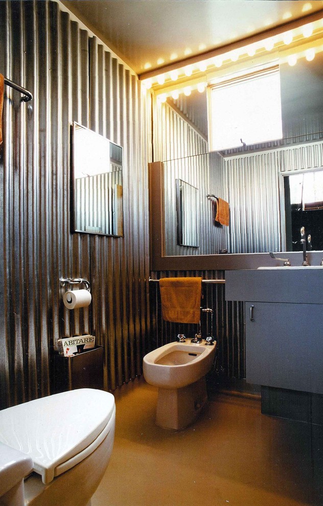 Industrial bathroom in San Francisco with a bidet.