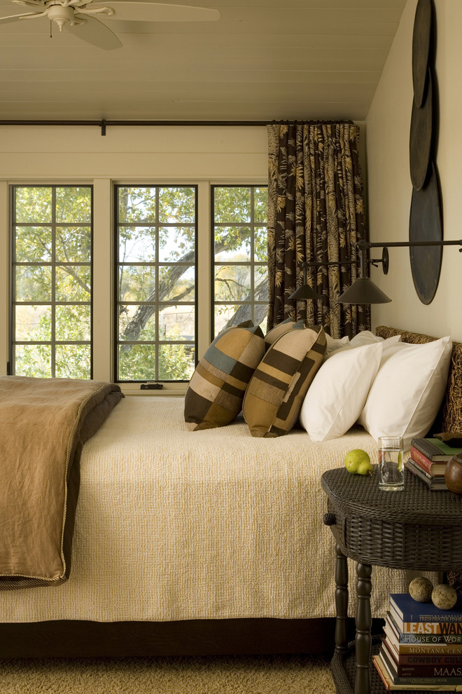 Bedroom - mid-sized rustic carpeted bedroom idea with beige walls