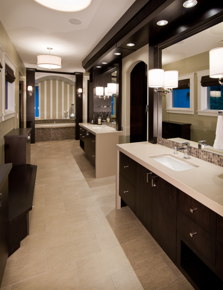 Inspiration for an expansive contemporary master bathroom in Denver with flat-panel cabinets, dark wood cabinets, an undermount tub, glass tile, beige walls, an undermount sink and engineered quartz benchtops.