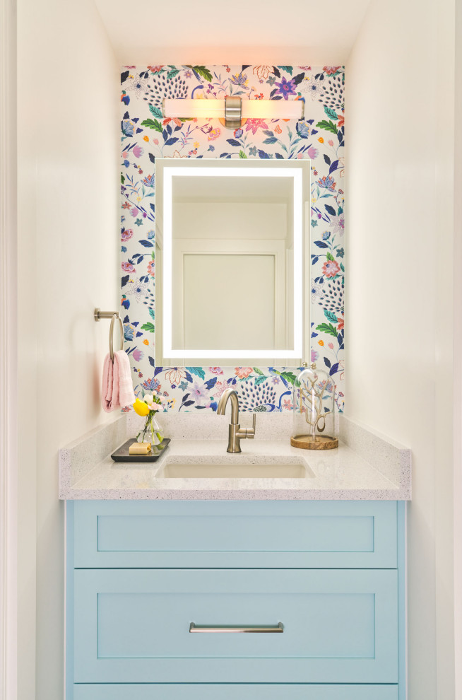 Photo of a small contemporary kids bathroom in Austin with shaker cabinets, an undermount sink, a single vanity, a built-in vanity and wallpaper.