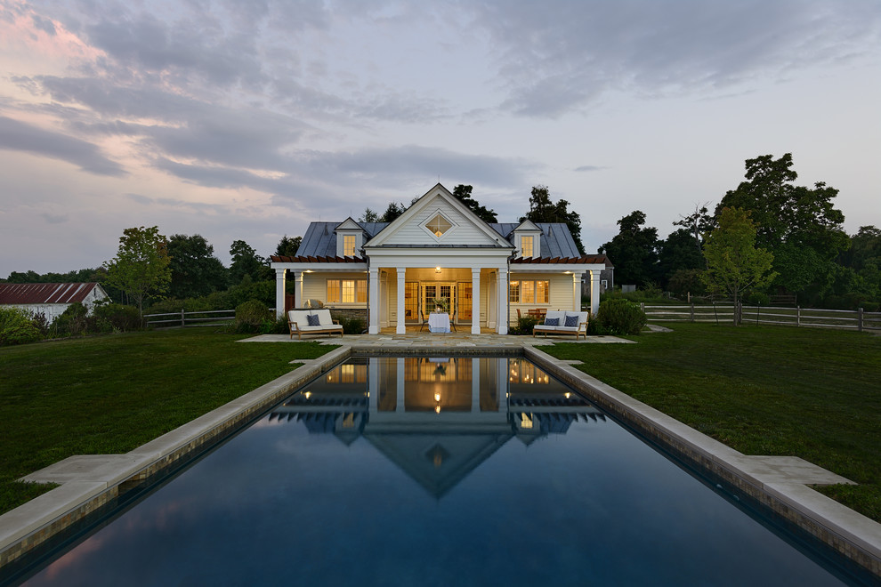 Design ideas for a country rectangular pool in New York with a pool house.