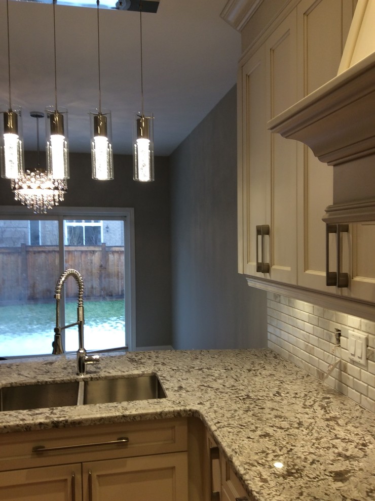 Example of a transitional kitchen design in Toronto