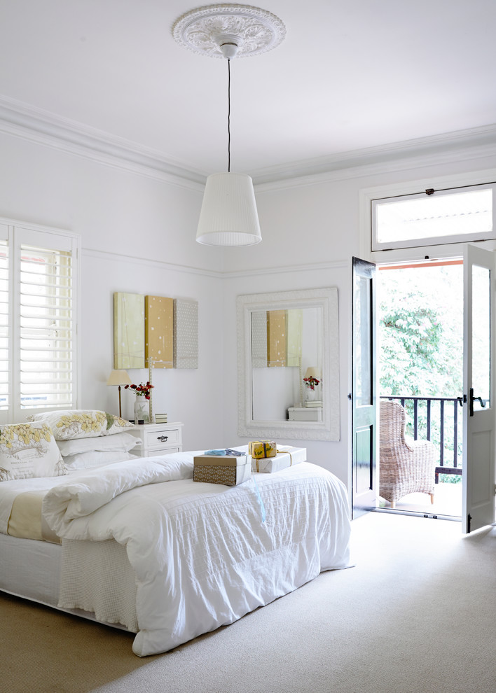 Design ideas for a transitional master bedroom in Melbourne with white walls, carpet and no fireplace.