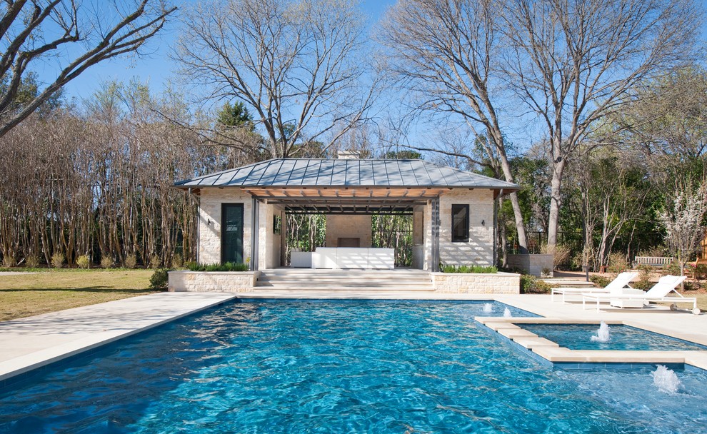 Contemporary rectangular pool in Dallas with a pool house.