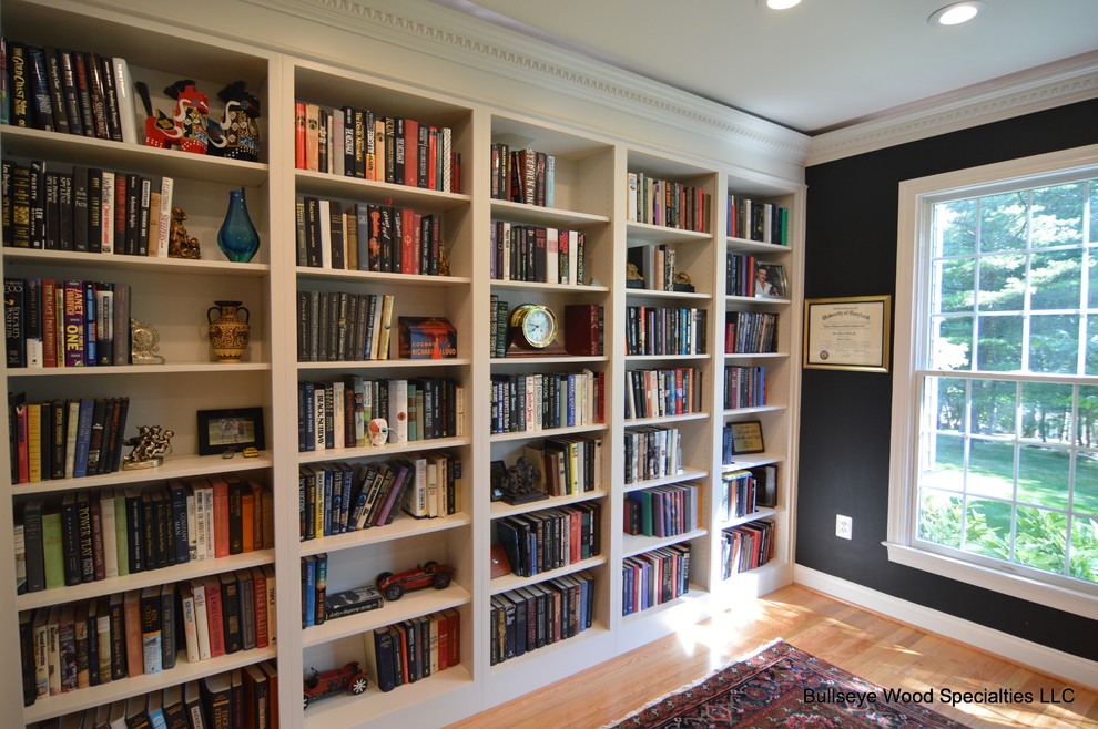 Design ideas for a mid-sized traditional home office in DC Metro with a library and blue walls.