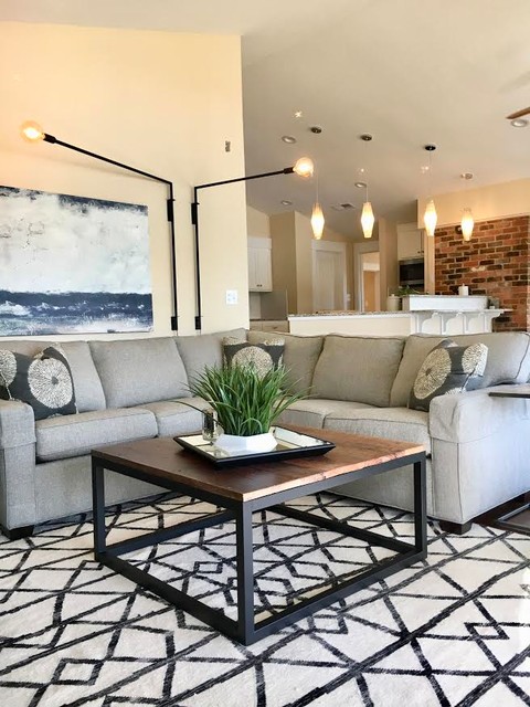 Mid-sized transitional open concept medium tone wood floor living room photo in Charlotte with yellow walls