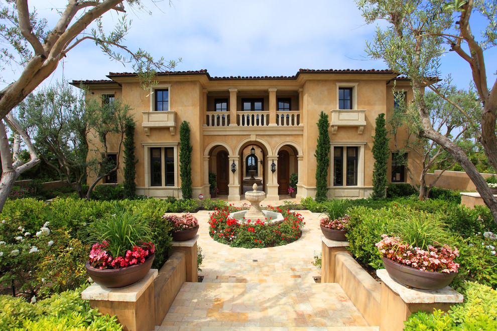 This is an example of a mediterranean two-storey exterior in Los Angeles with a hip roof.