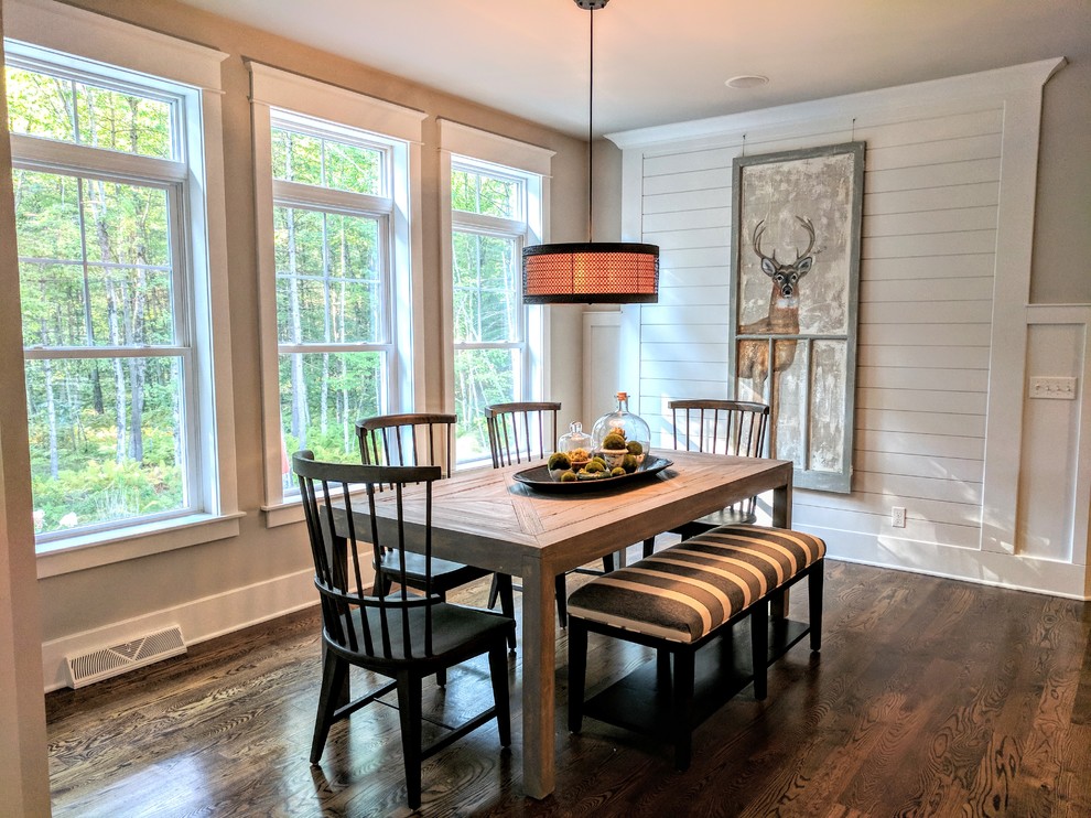 Mid-sized country kitchen/dining combo in Boston with grey walls, dark hardwood floors, brown floor and no fireplace.