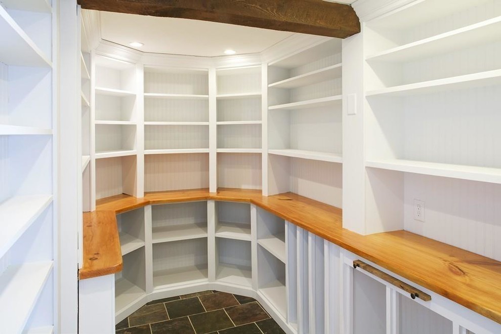 Inspiration for a country kitchen pantry in Philadelphia with open cabinets, wood benchtops, ceramic floors, multi-coloured floor and brown benchtop.
