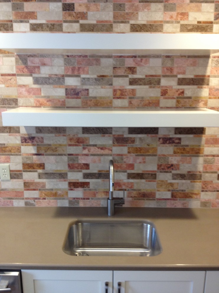 Mid-sized transitional l-shaped utility room photo with an undermount sink, shaker cabinets, white cabinets, quartz countertops, beige walls and a side-by-side washer/dryer