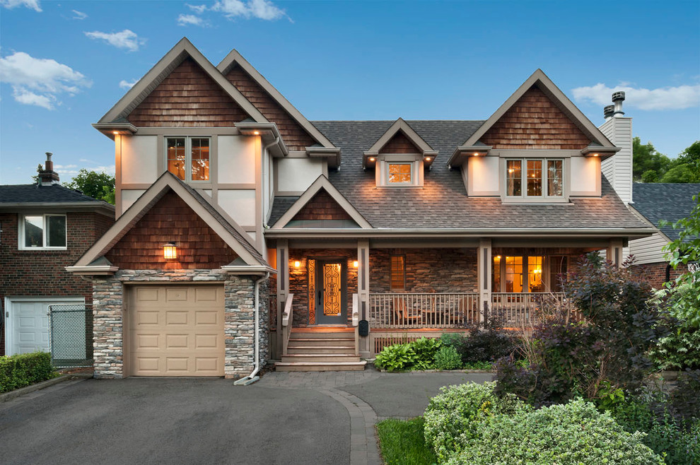 Traditional two-storey exterior in Toronto with wood siding.
