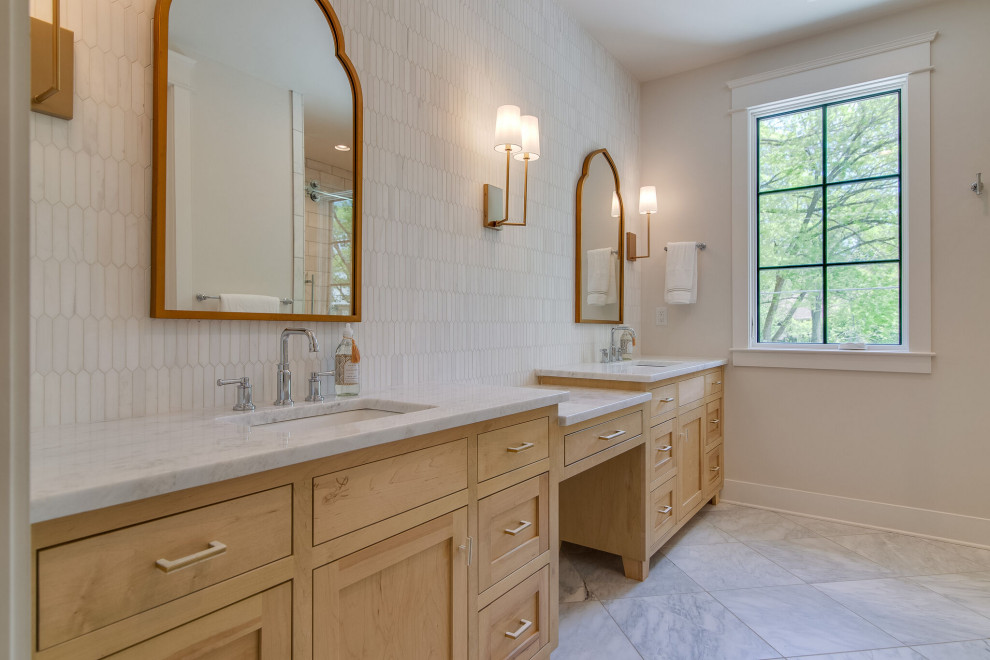 Large traditional ensuite bathroom in Nashville with shaker cabinets, light wood cabinets, an alcove shower, white tiles, stone tiles, white walls, marble flooring, a submerged sink, marble worktops, a sliding door, white worktops, double sinks and a built in vanity unit.