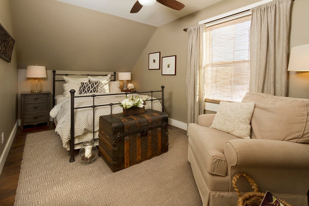 Design ideas for a mid-sized country guest bedroom in Minneapolis with beige walls and dark hardwood floors.
