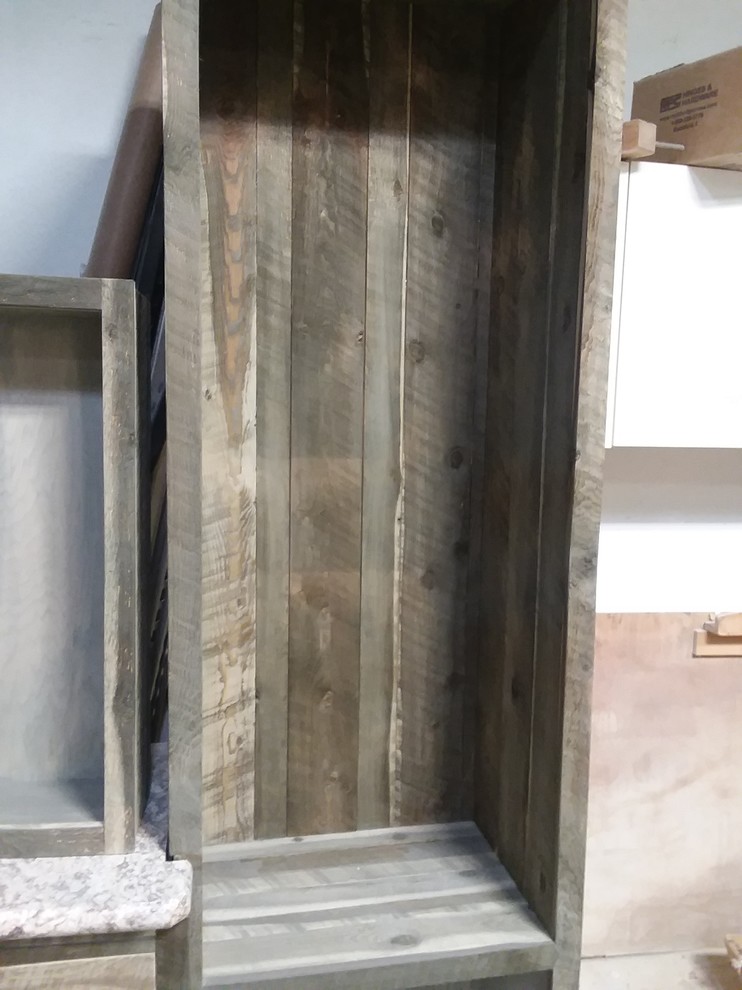 Example of a mountain style master bathroom design with shaker cabinets and laminate countertops