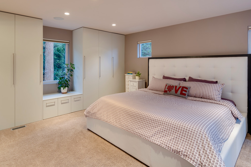 Inspiration for a large contemporary master bedroom in Vancouver with beige walls, carpet, no fireplace and beige floor.