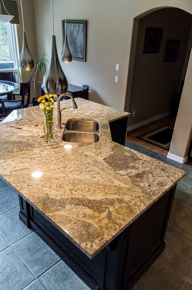 Example of a transitional home design design in Vancouver