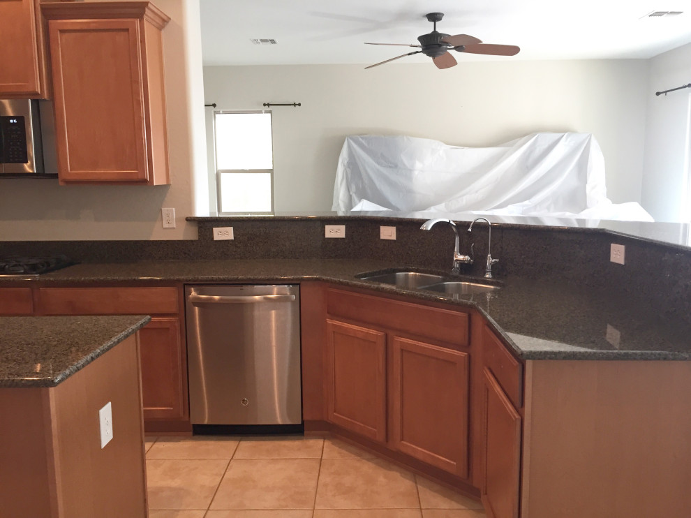 Mid-sized transitional kitchen photo in Phoenix with recessed-panel cabinets, stainless steel appliances and an island