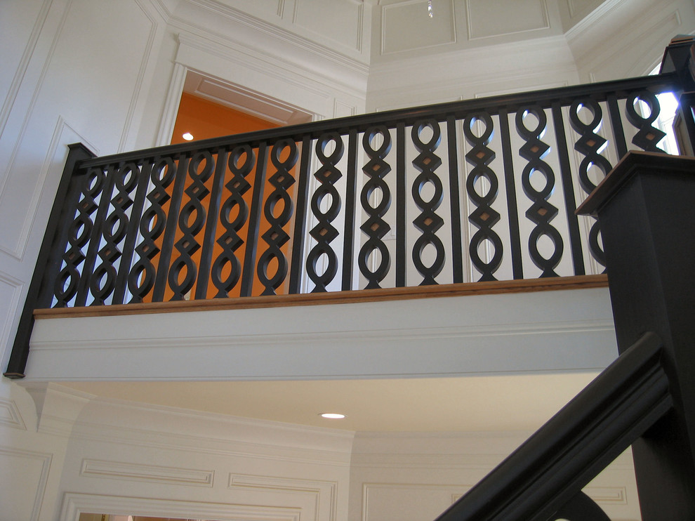 Inspiration for a large classic wood staircase in Louisville with painted wood risers.