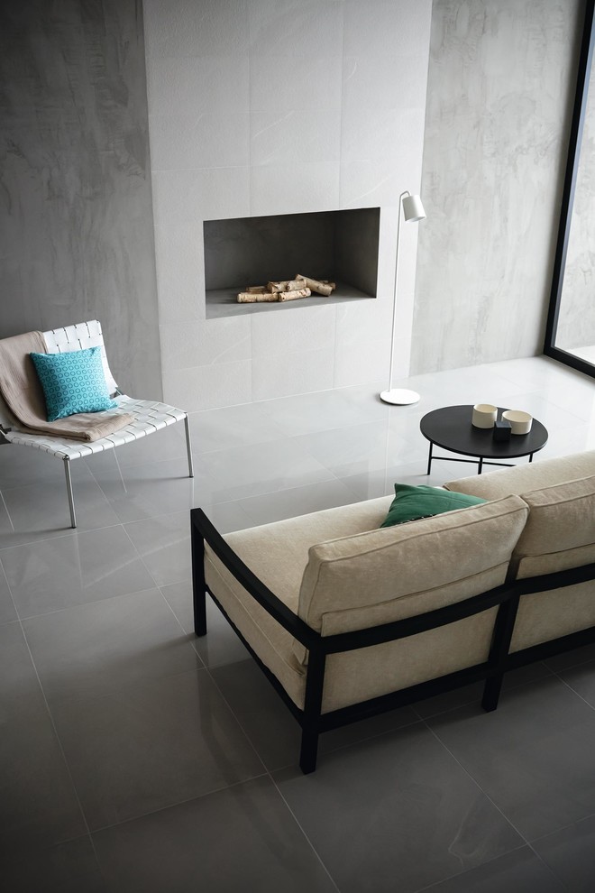 Inspiration for a modern living room in Other with grey walls, porcelain floors and a tile fireplace surround.