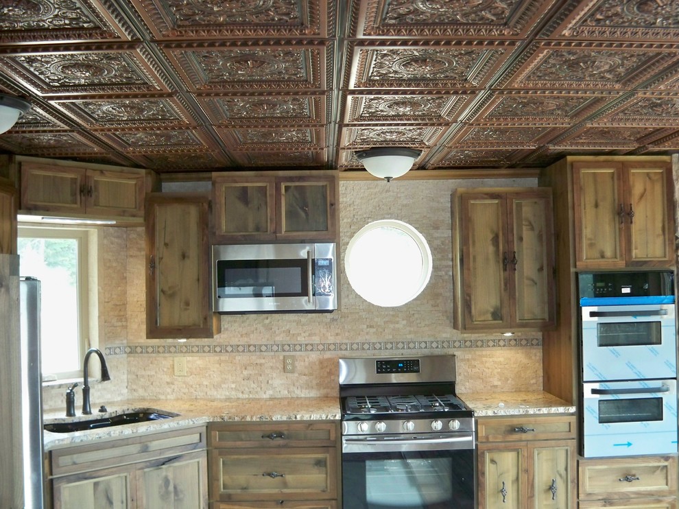 Inspiration for a rustic kitchen remodel in Seattle with flat-panel cabinets and quartzite countertops