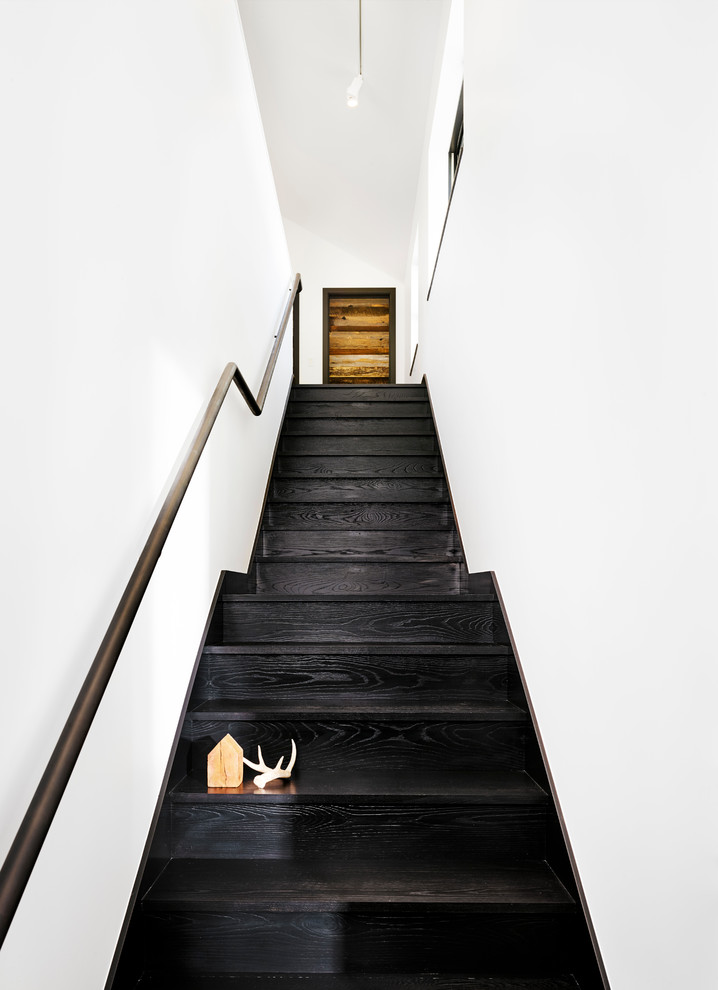 Staircase - modern wooden straight metal railing staircase idea in Austin