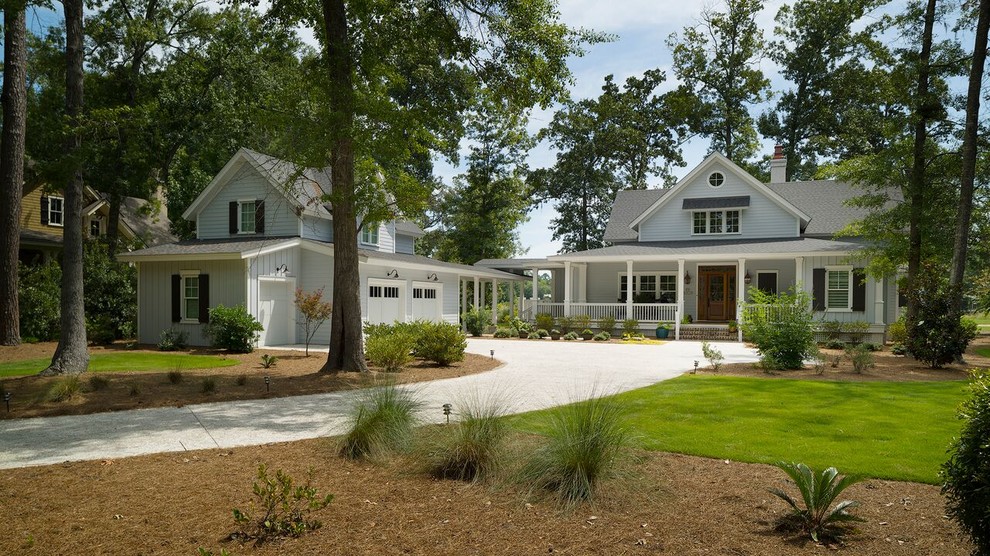 Inspiration for a mid-sized traditional two-storey blue exterior in Atlanta with mixed siding.