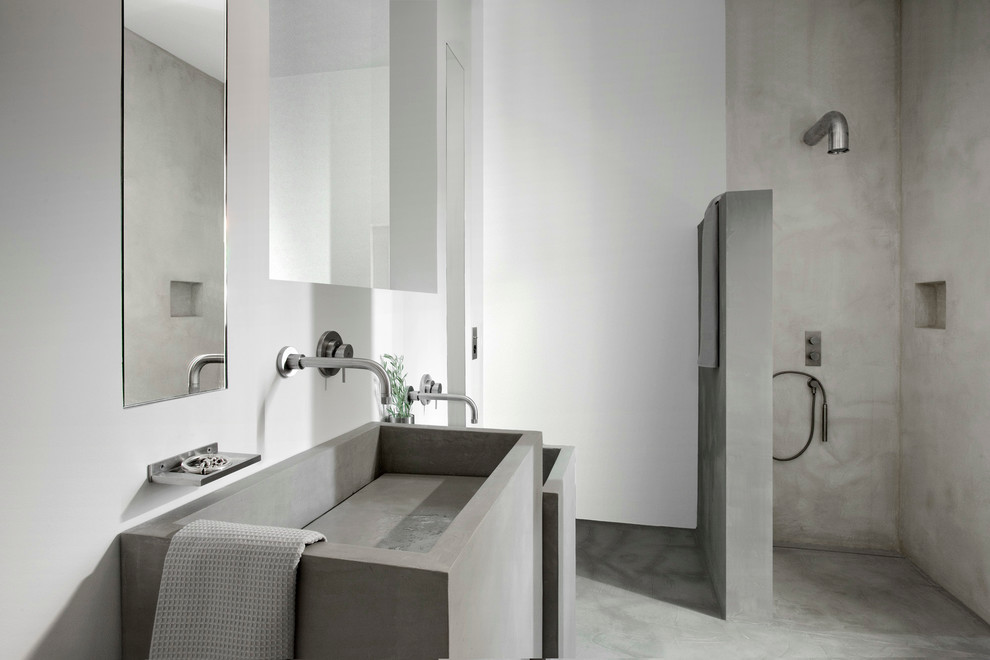 Mediterranean bathroom in Other with an open shower, white walls, concrete floors and an open shower.
