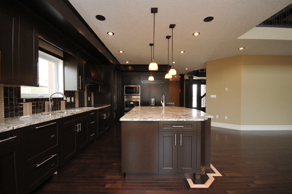 Transitional home design photo in Edmonton