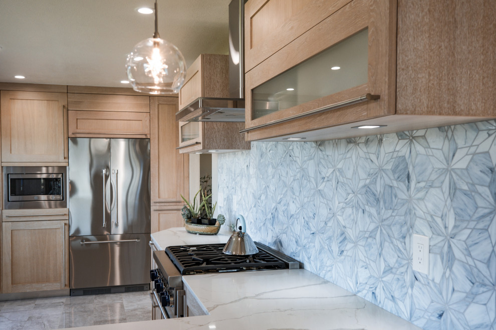 Small transitional u-shaped ceramic tile and beige floor open concept kitchen photo in San Francisco with a double-bowl sink, recessed-panel cabinets, light wood cabinets, quartz countertops, white backsplash, quartz backsplash, stainless steel appliances and white countertops