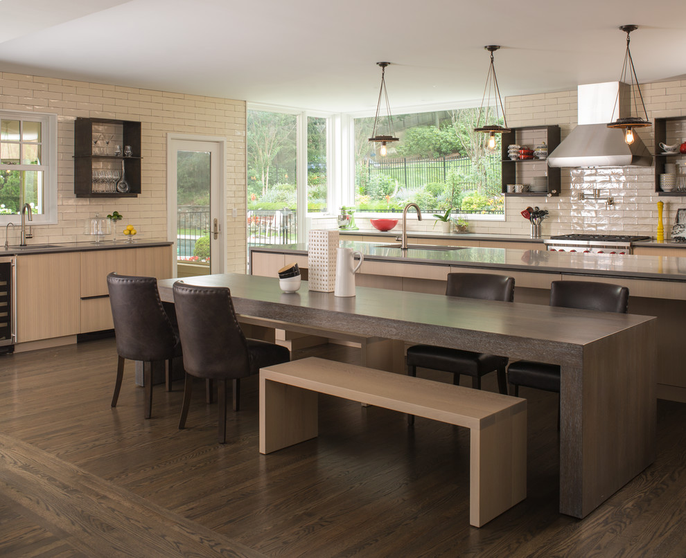 Photo of a contemporary kitchen/dining combo in New York with dark hardwood floors.