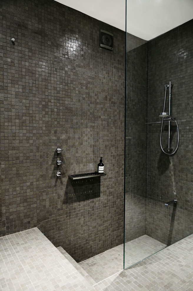 Inspiration for a contemporary bathroom in Sydney with a curbless shower and gray tile.