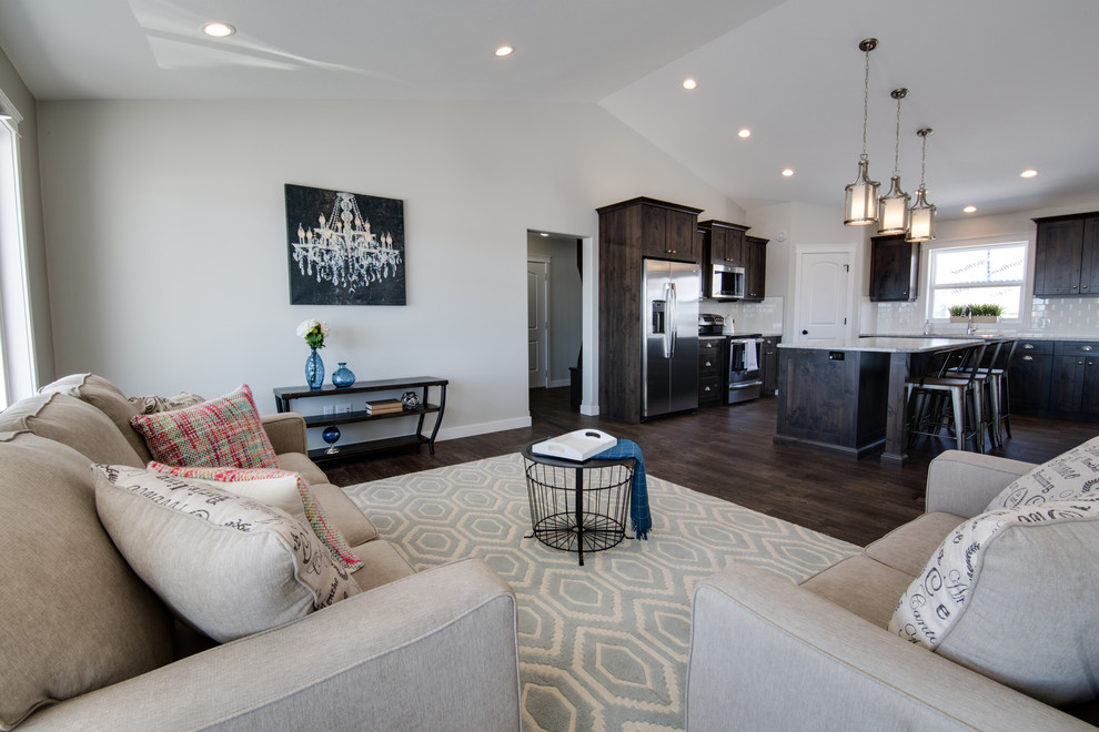 Open concept kitchen - mid-sized transitional l-shaped open concept kitchen idea with shaker cabinets, dark wood cabinets, laminate countertops, stainless steel appliances and an island