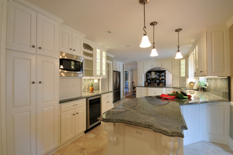 Large transitional galley kitchen photo in DC Metro with raised-panel cabinets, white cabinets, granite countertops, stainless steel appliances and a peninsula