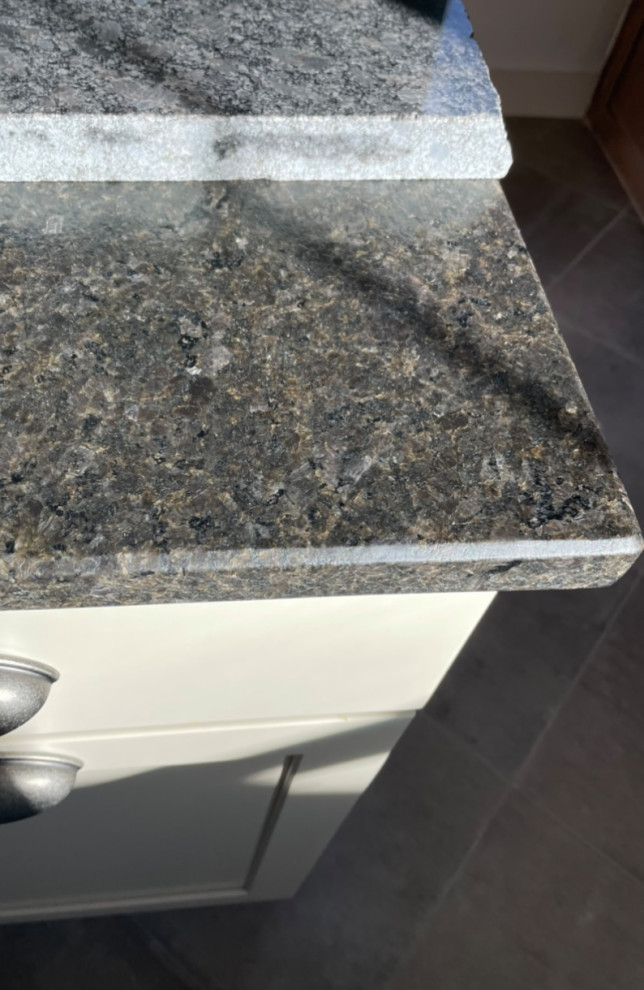 Countertop leathered granite changing color ( !! )