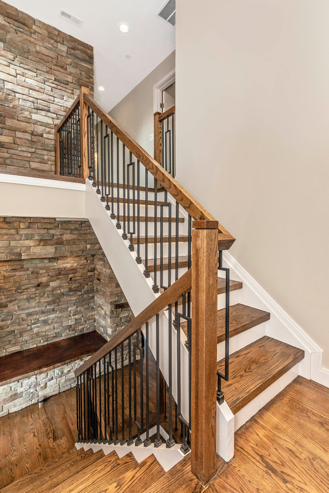 Photo of a mid-sized traditional wood u-shaped staircase in Baltimore with mixed railing.
