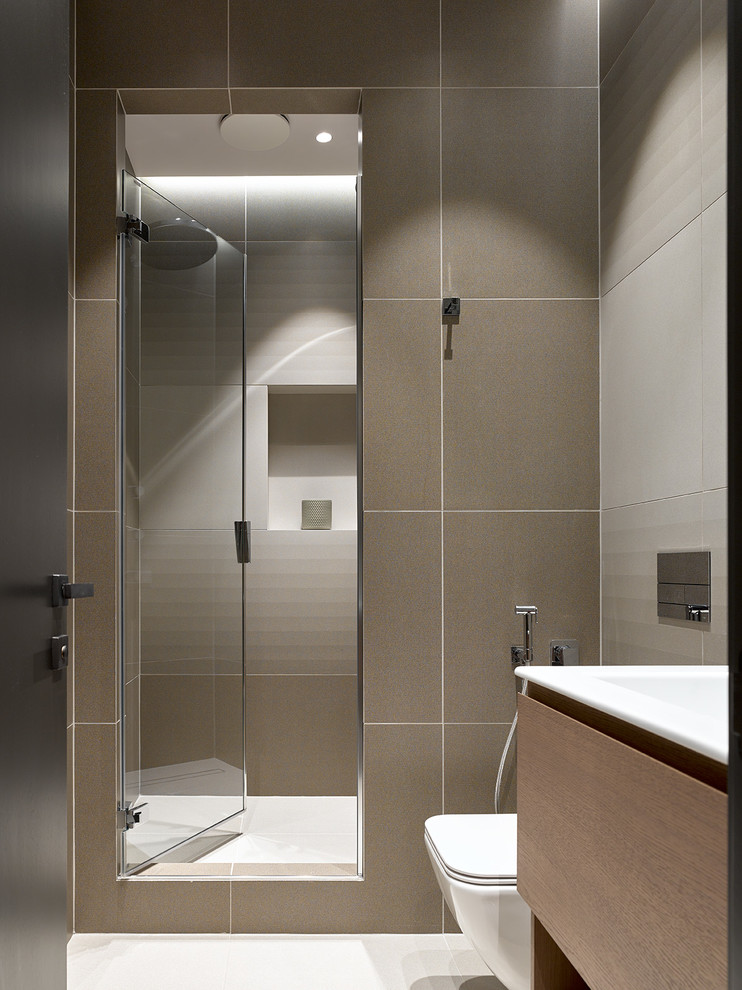 Photo of a contemporary 3/4 bathroom in Moscow with flat-panel cabinets, medium wood cabinets, an alcove shower, beige tile, an integrated sink and beige floor.