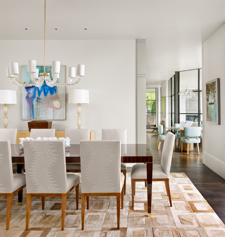 Photo of a transitional separate dining room in Austin with white walls and dark hardwood floors.