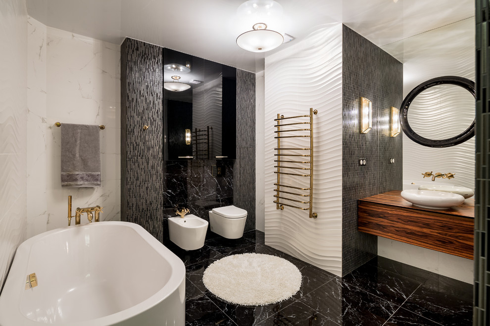 Design ideas for a large contemporary bathroom in Other with flat-panel cabinets, dark wood cabinets, a freestanding tub, a shower/bathtub combo, a wall-mount toilet, white tile, ceramic tile, ceramic floors, wood benchtops, black floor, an open shower and a vessel sink.