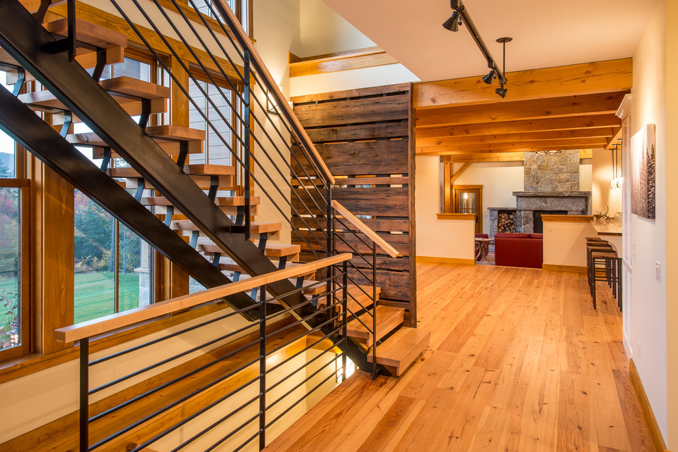 Inspiration for a mid-sized country wood l-shaped staircase in Burlington with open risers.